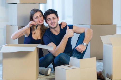 Professional packing services in Poplar preparing household boxes for a move