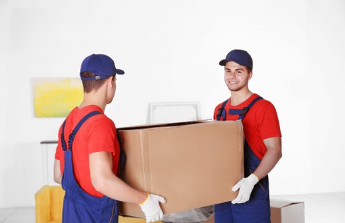 Carefully planned house removals in Poplar with moving boxes and a removal van