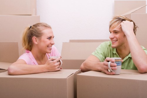 Professional flat removals in Poplar with moving van outside an apartment block