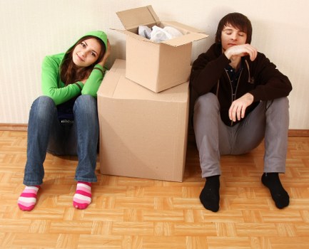 Professional movers handling furniture during a Poplar small move