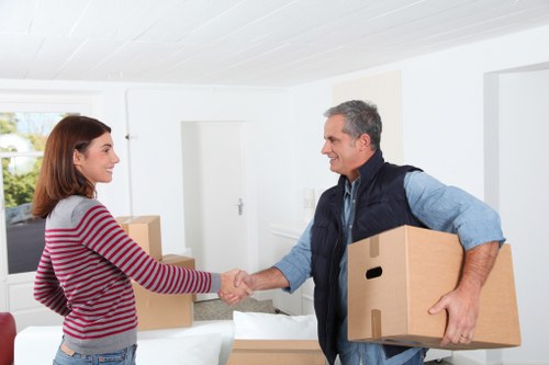 Local Poplar moving team handling furniture in a residential street